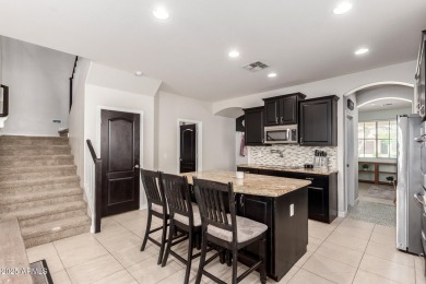 Gorgeous former model home located in the heart of Verrado! This on Verrado Golf Club  in Arizona - for sale on GolfHomes.com, golf home, golf lot