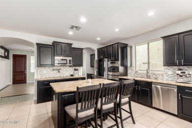 Gorgeous former model home located in the heart of Verrado! This on Verrado Golf Club  in Arizona - for sale on GolfHomes.com, golf home, golf lot