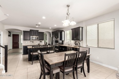 Gorgeous former model home located in the heart of Verrado! This on Verrado Golf Club  in Arizona - for sale on GolfHomes.com, golf home, golf lot