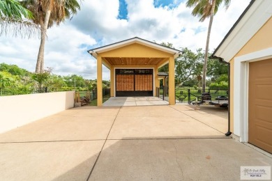 Tucked along the fairway in Rancho Escondido, this 4,037 sq ft on Rancho Viejo Resort and Country Club in Texas - for sale on GolfHomes.com, golf home, golf lot