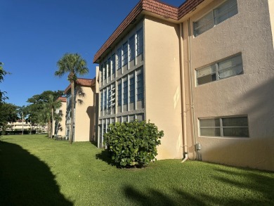 Corner 2nd-floor 2-bedroom, 2-bath condo at Villages of Oriole on Marina Lakes Golf Course in Florida - for sale on GolfHomes.com, golf home, golf lot