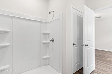 The Walker is a beautifully designed two-story home that blends on Harbour Point Golf Club in North Carolina - for sale on GolfHomes.com, golf home, golf lot