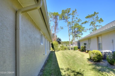 Welcome to your next haven with a scenic backyard view of the on Plantation Bay Golf and Country Club in Florida - for sale on GolfHomes.com, golf home, golf lot