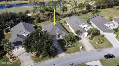 Welcome to your next haven with a scenic backyard view of the on Plantation Bay Golf and Country Club in Florida - for sale on GolfHomes.com, golf home, golf lot