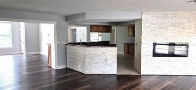 Spacious and versatile, this 4-bedroom, 3-bath home with a on Golf Hammock Country Club in Florida - for sale on GolfHomes.com, golf home, golf lot