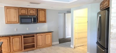 Spacious and versatile, this 4-bedroom, 3-bath home with a on Golf Hammock Country Club in Florida - for sale on GolfHomes.com, golf home, golf lot