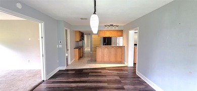 Spacious and versatile, this 4-bedroom, 3-bath home with a on Golf Hammock Country Club in Florida - for sale on GolfHomes.com, golf home, golf lot