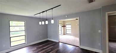 Spacious and versatile, this 4-bedroom, 3-bath home with a on Golf Hammock Country Club in Florida - for sale on GolfHomes.com, golf home, golf lot