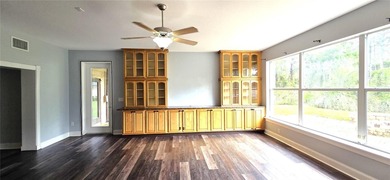 Spacious and versatile, this 4-bedroom, 3-bath home with a on Golf Hammock Country Club in Florida - for sale on GolfHomes.com, golf home, golf lot