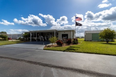 Welcome to this charming 2014 home in the peaceful Whispering on Lily Lake Golf and RV Resort in Florida - for sale on GolfHomes.com, golf home, golf lot