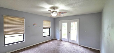 Spacious and versatile, this 4-bedroom, 3-bath home with a on Golf Hammock Country Club in Florida - for sale on GolfHomes.com, golf home, golf lot