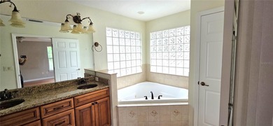 Spacious and versatile, this 4-bedroom, 3-bath home with a on Golf Hammock Country Club in Florida - for sale on GolfHomes.com, golf home, golf lot