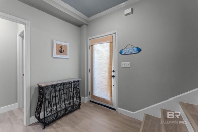 Start your morning with a coffee on the porch swing while you on Kiva Dunes Golf Club in Alabama - for sale on GolfHomes.com, golf home, golf lot