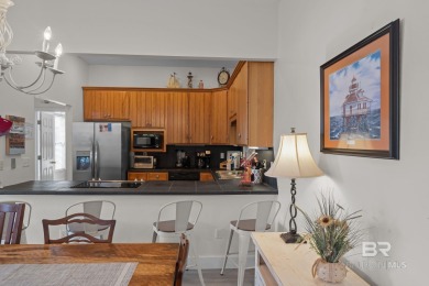 Start your morning with a coffee on the porch swing while you on Kiva Dunes Golf Club in Alabama - for sale on GolfHomes.com, golf home, golf lot