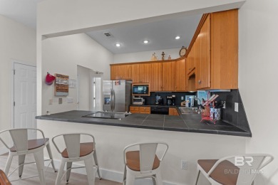 Start your morning with a coffee on the porch swing while you on Kiva Dunes Golf Club in Alabama - for sale on GolfHomes.com, golf home, golf lot