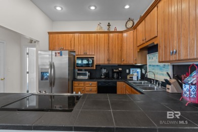 Start your morning with a coffee on the porch swing while you on Kiva Dunes Golf Club in Alabama - for sale on GolfHomes.com, golf home, golf lot