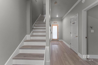 Start your morning with a coffee on the porch swing while you on Kiva Dunes Golf Club in Alabama - for sale on GolfHomes.com, golf home, golf lot