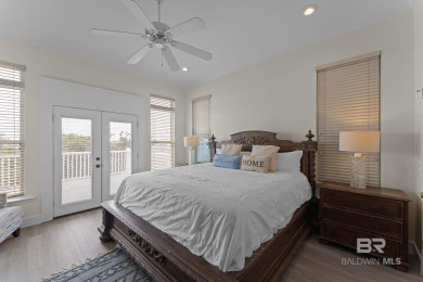 Start your morning with a coffee on the porch swing while you on Kiva Dunes Golf Club in Alabama - for sale on GolfHomes.com, golf home, golf lot