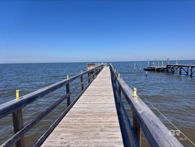Start your morning with a coffee on the porch swing while you on Kiva Dunes Golf Club in Alabama - for sale on GolfHomes.com, golf home, golf lot