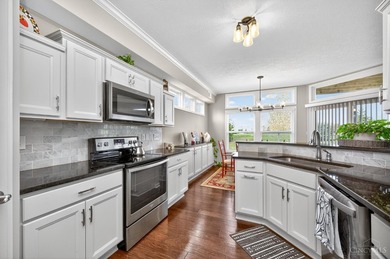 Step into a meticulous first-floor end unit with stunning Shaker on Shaker Run Golf Club  in Ohio - for sale on GolfHomes.com, golf home, golf lot