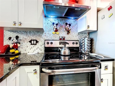 Turnkey 3 Bed, 2 Bath Mickey Mouse-Themed Pool Home in Ridgewood on Ridgewood Lakes Golf and Country Club in Florida - for sale on GolfHomes.com, golf home, golf lot