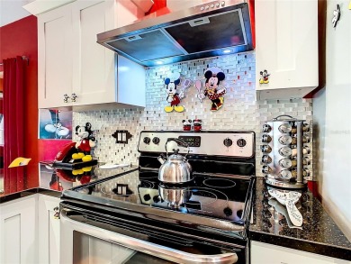 Turnkey 3 Bed, 2 Bath Mickey Mouse-Themed Pool Home in Ridgewood on Ridgewood Lakes Golf and Country Club in Florida - for sale on GolfHomes.com, golf home, golf lot