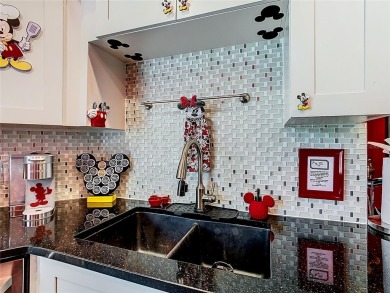 Turnkey 3 Bed, 2 Bath Mickey Mouse-Themed Pool Home in Ridgewood on Ridgewood Lakes Golf and Country Club in Florida - for sale on GolfHomes.com, golf home, golf lot