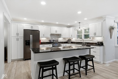 Discover this completely remodeled lakefront gem on Morse on Harbour Trees Golf Club in Indiana - for sale on GolfHomes.com, golf home, golf lot