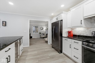 Discover this completely remodeled lakefront gem on Morse on Harbour Trees Golf Club in Indiana - for sale on GolfHomes.com, golf home, golf lot