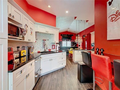 Turnkey 3 Bed, 2 Bath Mickey Mouse-Themed Pool Home in Ridgewood on Ridgewood Lakes Golf and Country Club in Florida - for sale on GolfHomes.com, golf home, golf lot