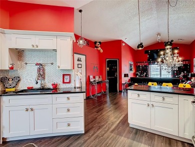 Turnkey 3 Bed, 2 Bath Mickey Mouse-Themed Pool Home in Ridgewood on Ridgewood Lakes Golf and Country Club in Florida - for sale on GolfHomes.com, golf home, golf lot