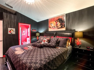 Turnkey 3 Bed, 2 Bath Mickey Mouse-Themed Pool Home in Ridgewood on Ridgewood Lakes Golf and Country Club in Florida - for sale on GolfHomes.com, golf home, golf lot