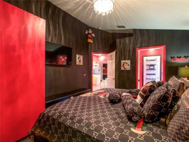 Turnkey 3 Bed, 2 Bath Mickey Mouse-Themed Pool Home in Ridgewood on Ridgewood Lakes Golf and Country Club in Florida - for sale on GolfHomes.com, golf home, golf lot
