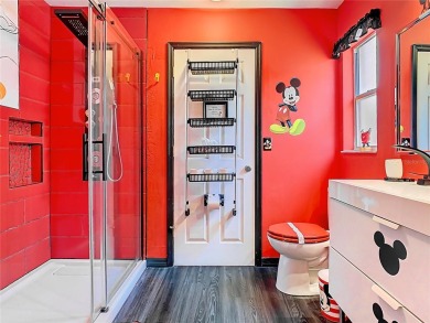 Turnkey 3 Bed, 2 Bath Mickey Mouse-Themed Pool Home in Ridgewood on Ridgewood Lakes Golf and Country Club in Florida - for sale on GolfHomes.com, golf home, golf lot