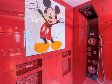 Turnkey 3 Bed, 2 Bath Mickey Mouse-Themed Pool Home in Ridgewood on Ridgewood Lakes Golf and Country Club in Florida - for sale on GolfHomes.com, golf home, golf lot