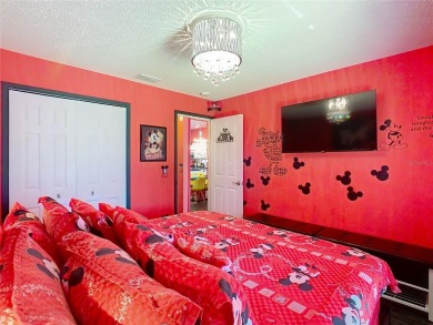 Turnkey 3 Bed, 2 Bath Mickey Mouse-Themed Pool Home in Ridgewood on Ridgewood Lakes Golf and Country Club in Florida - for sale on GolfHomes.com, golf home, golf lot