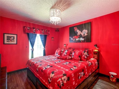Turnkey 3 Bed, 2 Bath Mickey Mouse-Themed Pool Home in Ridgewood on Ridgewood Lakes Golf and Country Club in Florida - for sale on GolfHomes.com, golf home, golf lot