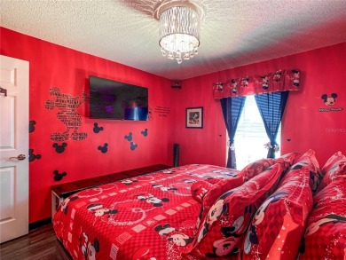 Turnkey 3 Bed, 2 Bath Mickey Mouse-Themed Pool Home in Ridgewood on Ridgewood Lakes Golf and Country Club in Florida - for sale on GolfHomes.com, golf home, golf lot