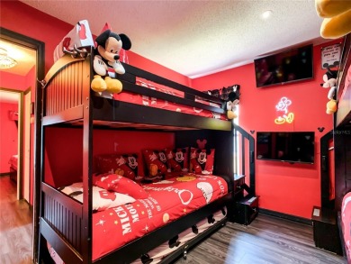 Turnkey 3 Bed, 2 Bath Mickey Mouse-Themed Pool Home in Ridgewood on Ridgewood Lakes Golf and Country Club in Florida - for sale on GolfHomes.com, golf home, golf lot