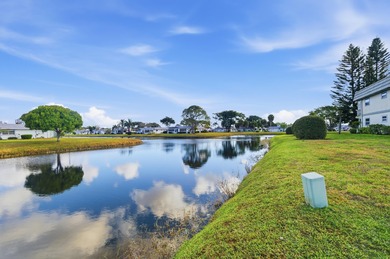 Beautiful corner unit with canal views pf community of Kings on Kings Point Golf -Flanders Way in Florida - for sale on GolfHomes.com, golf home, golf lot