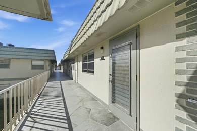 Beautiful corner unit with serene canal views in the highly on Kings Point Golf -Flanders Way in Florida - for sale on GolfHomes.com, golf home, golf lot