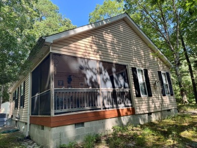 This cozy 2 bedroom 2 bath home located in a quiet section of on Captains Cove Golf and Yacht Club in Virginia - for sale on GolfHomes.com, golf home, golf lot