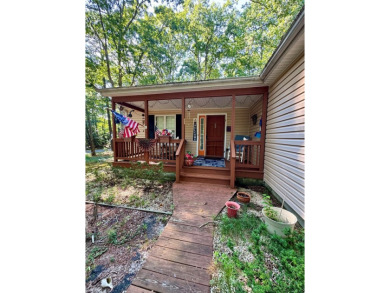 This cozy 2 bedroom 2 bath home located in a quiet section of on Captains Cove Golf and Yacht Club in Virginia - for sale on GolfHomes.com, golf home, golf lot