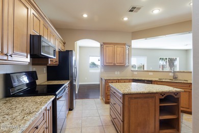 Stunning 3-bedroom home with a 3-car garage perfectly positioned on Arizona City Golf Club in Arizona - for sale on GolfHomes.com, golf home, golf lot