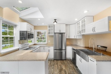 Lakeside living at its finest! Enjoy easy, one-level living in on Lake Lackawanna Golf Course in New Jersey - for sale on GolfHomes.com, golf home, golf lot