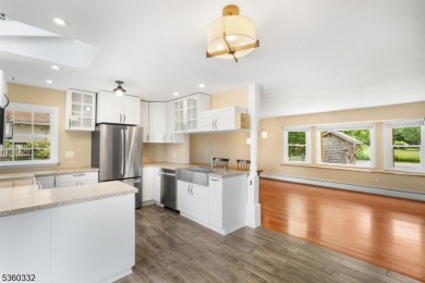 Lakeside living at its finest! Enjoy easy, one-level living in on Lake Lackawanna Golf Course in New Jersey - for sale on GolfHomes.com, golf home, golf lot