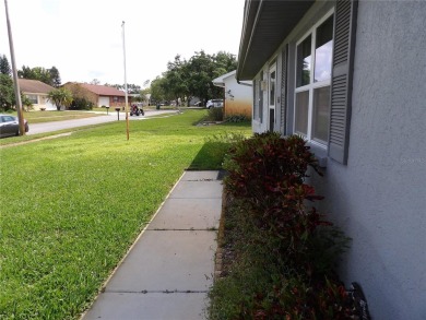 What a GEM of a house....Great Curb Appeal.....  Just a Hop on Highland Lakes Executive Golf Course in Florida - for sale on GolfHomes.com, golf home, golf lot