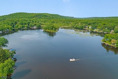 Lakeside living at its finest! Enjoy easy, one-level living in on Lake Lackawanna Golf Course in New Jersey - for sale on GolfHomes.com, golf home, golf lot