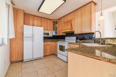 This spacious 2-story home offers 2,354 sq ft with 5 bedrooms, 3 on Desert Hawk At Pueblo West in Colorado - for sale on GolfHomes.com, golf home, golf lot