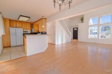 This spacious 2-story home offers 2,354 sq ft with 5 bedrooms, 3 on Desert Hawk At Pueblo West in Colorado - for sale on GolfHomes.com, golf home, golf lot